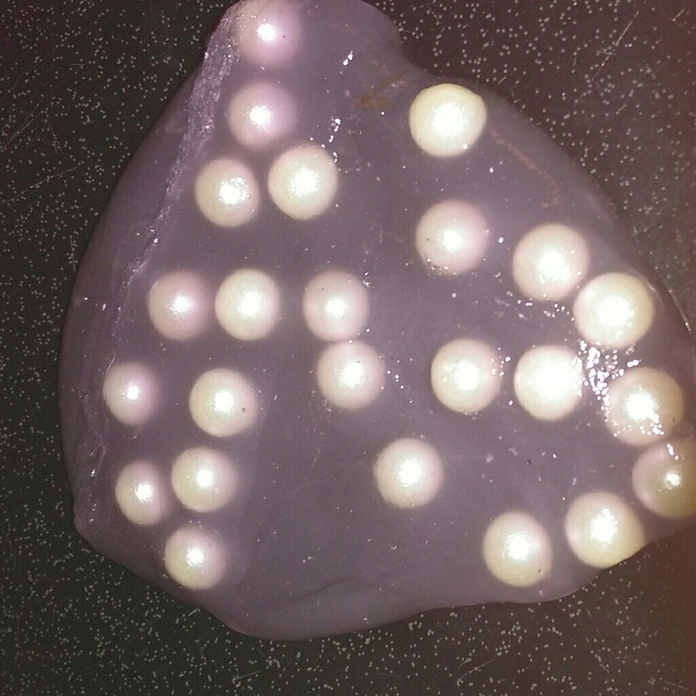 Clear purple slime with white pearls.